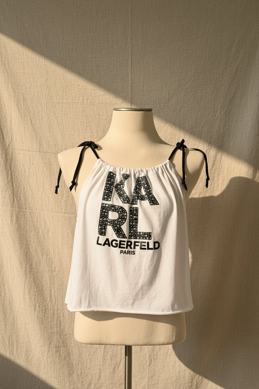 White tank top with 'Karl Lagerfeld' print on a mannequin against a beige background